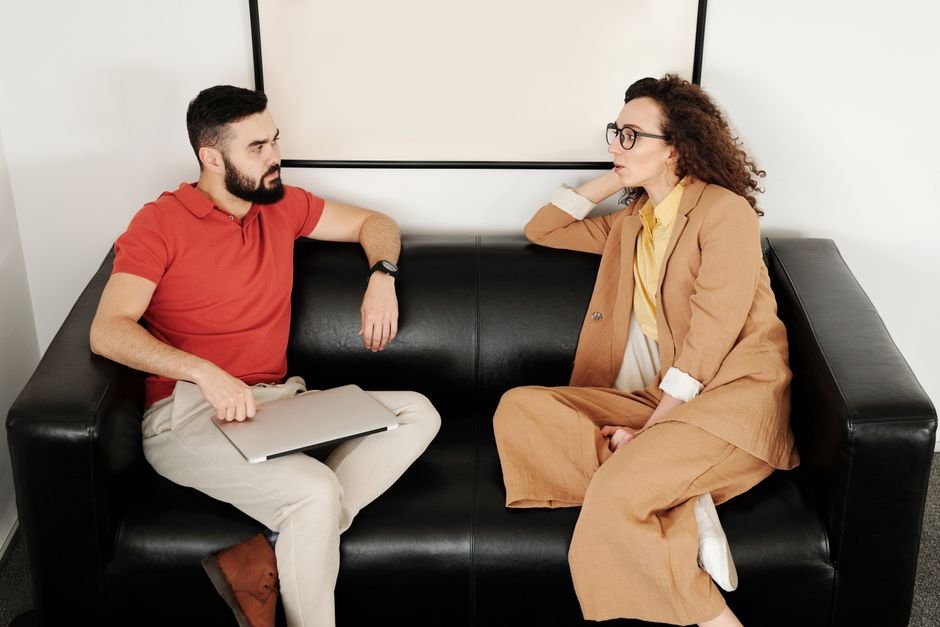 Two colleagues talking in an office