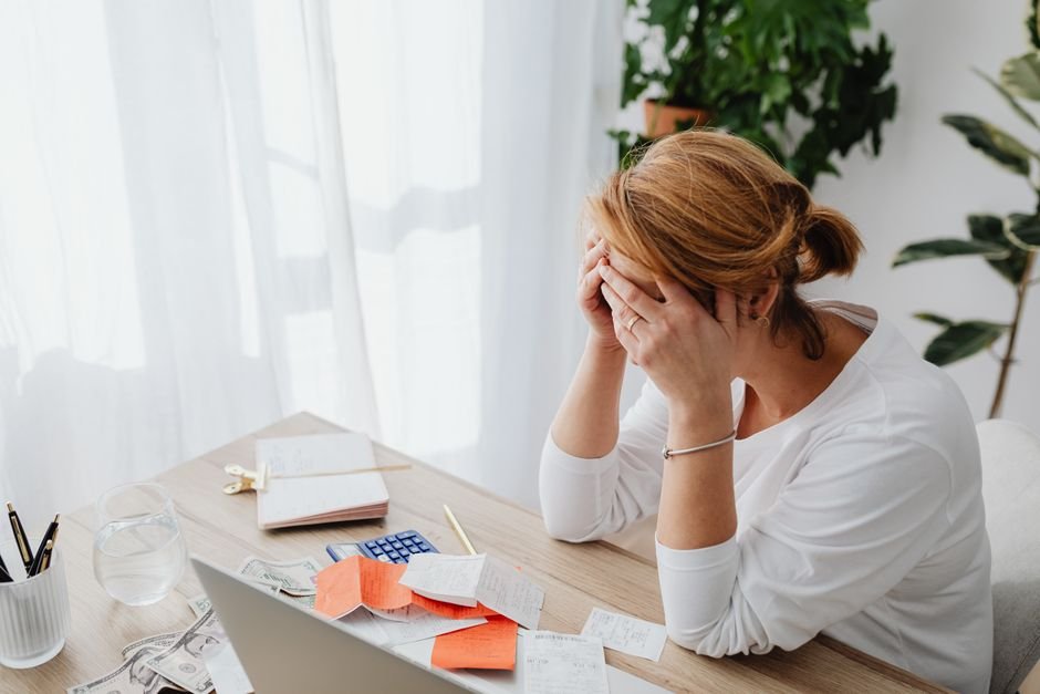 Person reviewing health plan paperwork at a desk