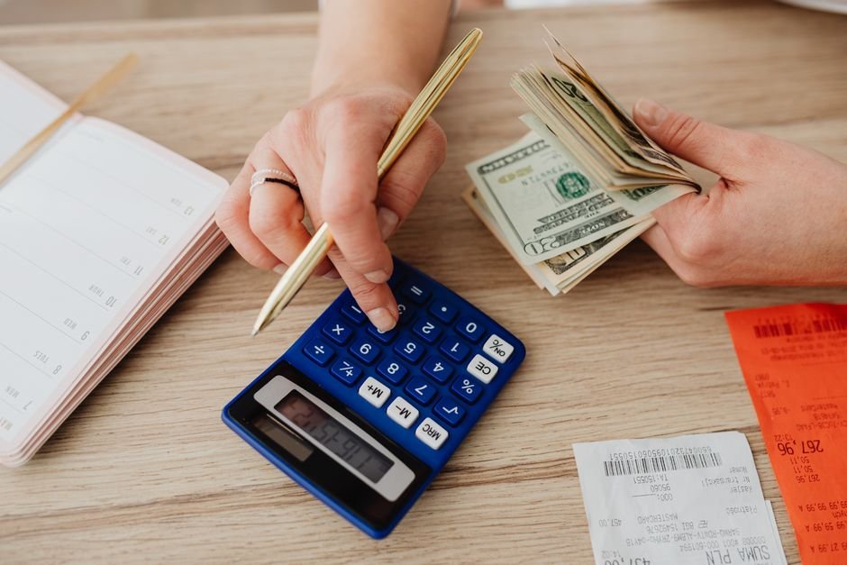 Planning a budget with a calculator and notebook