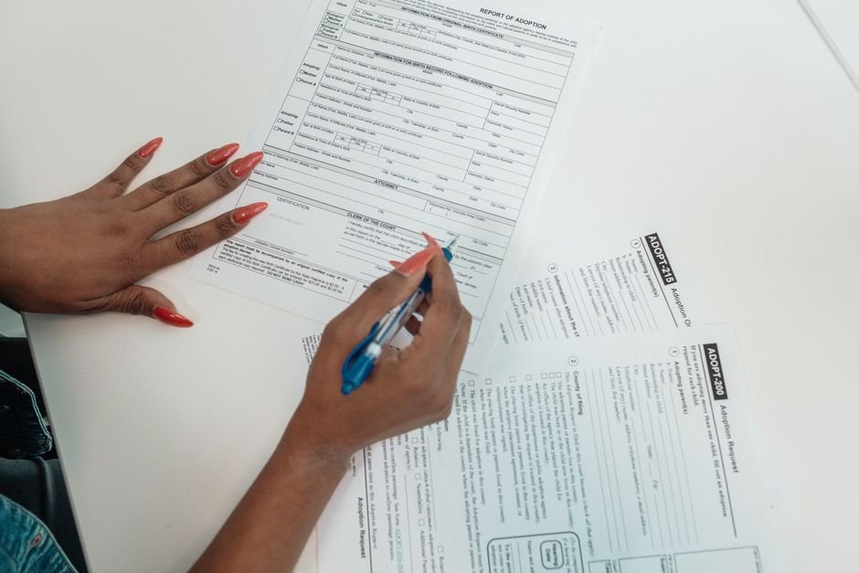 Completing an application form at a desk